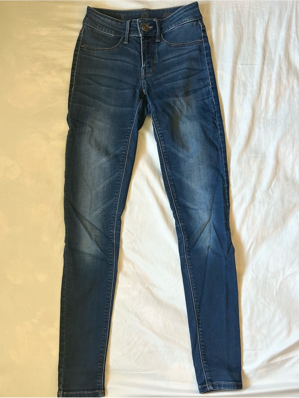 dark wash blue mid-rise skinny jeggings